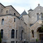 L’abbaye Saint-Benoît d'En-Calcat est une abbaye bénédictine en activité faisant partie de la congrégation de Subiaco. En-Calcat a été fondée en 1890 par Dom Romain Banquet (1840-1929), natif du lieu, venant de l'abbaye de la Pierre-Qui-Vire avec un groupe de moines. Cette fondation fut menée d'après les conseils d'une de ses dirigées, Marie Cronier, de l'abbaye de Jouarre, parallèlement à une fondation de bénédictines à Dourgne, l'abbaye Sainte-Scholastique. En-Calcat devient abbaye en 1894. Située sur le parcours de la via Tolosane, l'abbaye reçoit les pèlerins de Saint-Jacques-de-Compostelle ainsi que des visiteurs lors de retraites spirituelles grâce à son hôtellerie.
